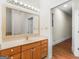 Bathroom with single sink vanity, mirror, and shower at 95 Fern Ct, Stockbridge, GA 30281