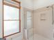 Bathroom with shower and window at 95 Fern Ct, Stockbridge, GA 30281