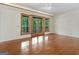 Bedroom with hardwood floors, French doors to deck, and ceiling fan at 95 Fern Ct, Stockbridge, GA 30281