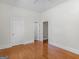 Hardwood floor bedroom with double doors at 95 Fern Ct, Stockbridge, GA 30281