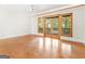 Bedroom with hardwood floors, French doors to deck, and ceiling fan at 95 Fern Ct, Stockbridge, GA 30281