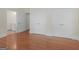 Hardwood floor bedroom with two closets and view of bathroom at 95 Fern Ct, Stockbridge, GA 30281