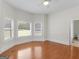 Hardwood floor bedroom with bay window and ceiling fan at 95 Fern Ct, Stockbridge, GA 30281