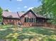 Brick house with large covered porch and nicely landscaped yard at 95 Fern Ct, Stockbridge, GA 30281