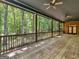 Screened porch with ceiling fans and view of backyard at 95 Fern Ct, Stockbridge, GA 30281