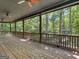 Large covered porch with brick pavers and wooded views at 95 Fern Ct, Stockbridge, GA 30281