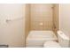 Simple bathroom featuring a bathtub, toilet, and tiled walls at 3130 Mars Hill Rd, Acworth, GA 30101