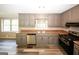 Kitchen with gray cabinets and stainless steel appliances at 3130 Mars Hill Rd, Acworth, GA 30101