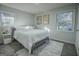 Main bedroom with two windows, gray flooring and rug at 3893 Bonnie Se Ln, Atlanta, GA 30354