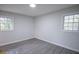 Well-lit bedroom featuring grey flooring and large windows at 3893 Bonnie Se Ln, Atlanta, GA 30354