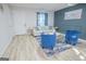 Living room with light beige sofa and blue accent chairs at 3893 Bonnie Se Ln, Atlanta, GA 30354