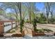 Landscaped backyard with two-car garage and seating areas at 3115 Pennington Sw St, Covington, GA 30014