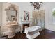 Luxurious bathroom with fireplace, soaking tub, and glass shower at 3115 Pennington Sw St, Covington, GA 30014