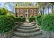 Brick home with stone steps and lush landscaping at 3115 Pennington Sw St, Covington, GA 30014