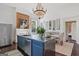 Spacious kitchen with stainless steel island, modern appliances, and exposed brick wall at 3115 Pennington Sw St, Covington, GA 30014