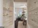 View of kitchen through built-in white cabinetry at 3115 Pennington Sw St, Covington, GA 30014