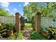 Brick pillars lead to a lush green backyard at 3115 Pennington Sw St, Covington, GA 30014