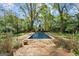 Inviting rectangular pool with brick patio and landscaping at 3115 Pennington Sw St, Covington, GA 30014