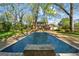 Rectangular swimming pool with brick coping at 3115 Pennington Sw St, Covington, GA 30014