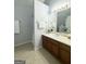 Bathroom with double vanity and tiled floors at 7665 Antebellum Ln, Riverdale, GA 30274