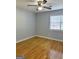 Bedroom with hardwood floors and a ceiling fan at 7665 Antebellum Ln, Riverdale, GA 30274