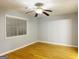 Well-lit bedroom with hardwood floors and window at 7665 Antebellum Ln, Riverdale, GA 30274