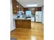 Galley style kitchen with granite countertops and wood cabinets at 7665 Antebellum Ln, Riverdale, GA 30274