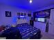 bedroom with race car bedding, blue LED lights, and a beanbag chair at 522 Pemberton St, Kingston, GA 30145