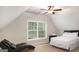 Comfortable bedroom with a queen bed, ceiling fan, and large window at 78 Bisbee Se Ave, Atlanta, GA 30315