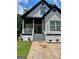 Charming 2-story house with white siding, black accents, and a landscaped yard at 78 Bisbee Se Ave, Atlanta, GA 30315