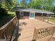 Spacious wooden deck with views of the surrounding trees and yard at 2362 Maxwell Dr, Atlanta, GA 30311