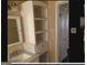 Bright bathroom features built-in shelving and storage above a modern sink and vanity at 2362 Maxwell Dr, Atlanta, GA 30311