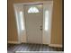 Welcoming entryway features a white door with sidelights and vinyl flooring at 2362 Maxwell Dr, Atlanta, GA 30311