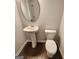 Clean bathroom with pedestal sink and toilet at 212 Himalaya Way, Mcdonough, GA 30253