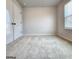 Simple bedroom with carpet, neutral walls, and a window at 212 Himalaya Way, Mcdonough, GA 30253