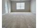 Spacious bedroom with neutral decor and large window at 212 Himalaya Way, Mcdonough, GA 30253