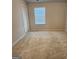 Spacious bedroom with neutral walls and carpet at 212 Himalaya Way, Mcdonough, GA 30253