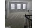 Spacious bonus room with carpeting and three windows at 212 Himalaya Way, Mcdonough, GA 30253