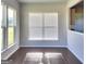 Simple dining room with hardwood floors and large window at 212 Himalaya Way, Mcdonough, GA 30253