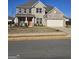 Two story house with brick facade and a two car garage at 212 Himalaya Way, Mcdonough, GA 30253