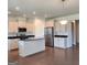 Modern kitchen with an island and dark countertops at 212 Himalaya Way, Mcdonough, GA 30253
