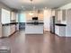 Open kitchen with large island and stainless steel appliances at 212 Himalaya Way, Mcdonough, GA 30253