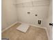 Laundry room with shelving and tile floor at 212 Himalaya Way, Mcdonough, GA 30253