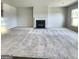 Spacious living room featuring a cozy fireplace at 212 Himalaya Way, Mcdonough, GA 30253