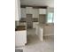 Kitchen view with white cabinets and an unfinished island at 115 Yancey Rd, Covington, GA 30014