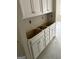 Kitchen featuring white cabinets and unfinished countertop at 115 Yancey Rd, Covington, GA 30014