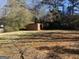 Backyard with shed and overgrown vegetation at 5324 Crystal Ln, Atlanta, GA 30349