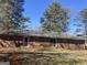 Rear view of brick ranch house, large yard at 5324 Crystal Ln, Atlanta, GA 30349