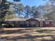 Brick ranch house with a large yard and mature trees at 5324 Crystal Ln, Atlanta, GA 30349