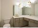 Bathroom with double vanity and updated gold fixtures at 13 Forest Ridge Ct, Sandy Springs, GA 30350